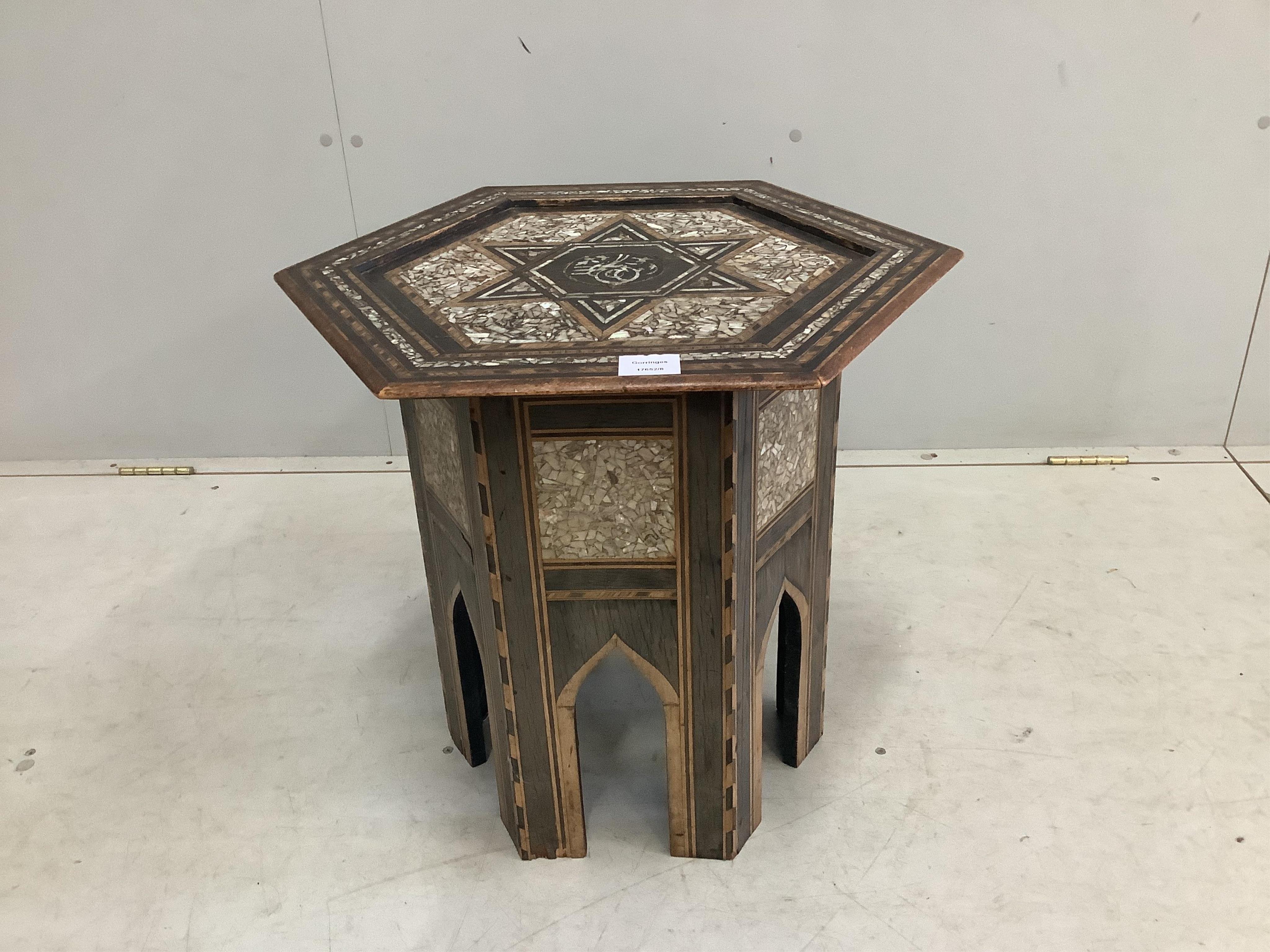 A Turkish Ottoman hexagonal mother of pearl inlaid table, width 49cm, height 51cm. Condition - fair